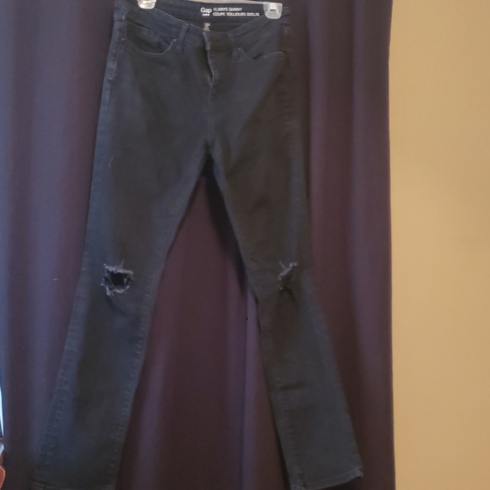 Distressed black skinny jeans